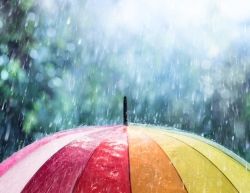 Regen valt op een kleurrijke paraplu